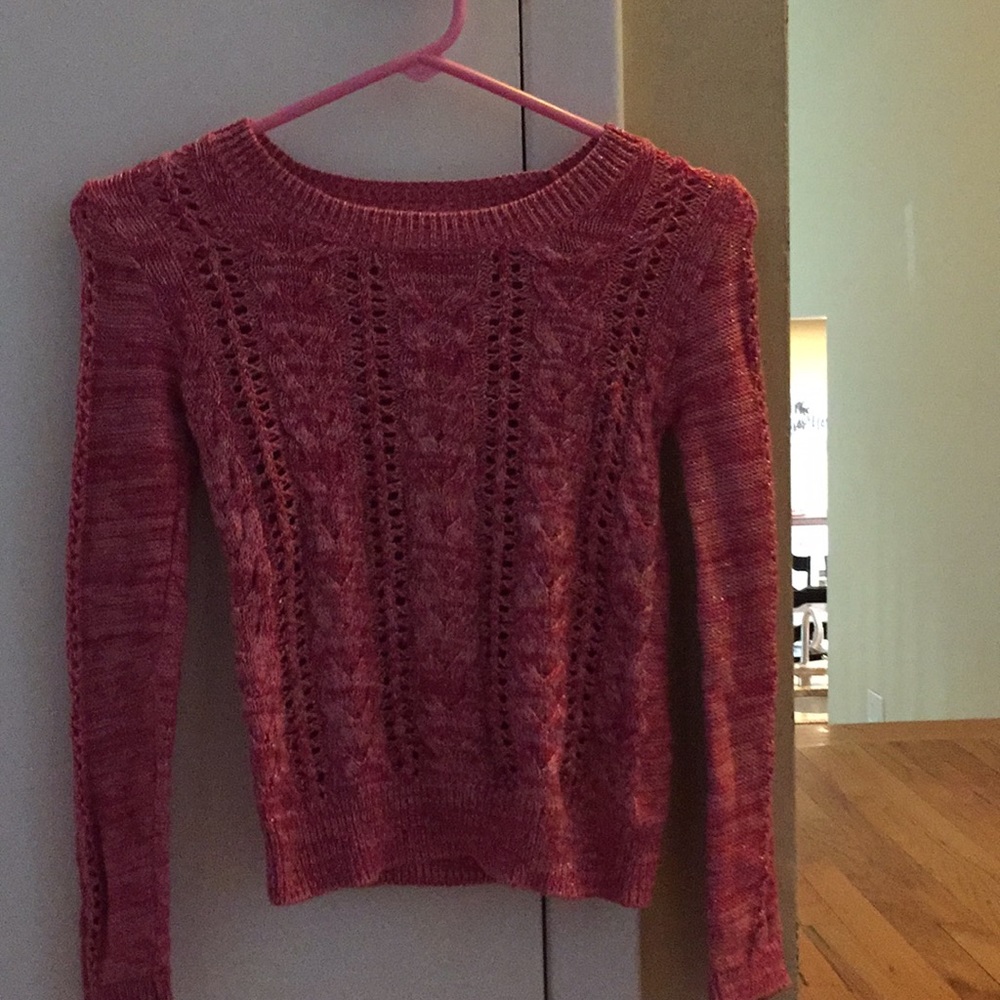 A hot pink and silver sweater.